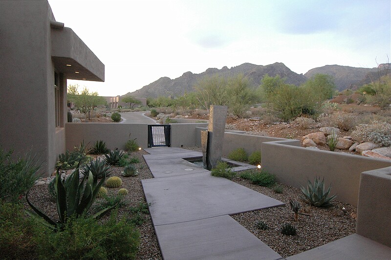 The front entry garden amd water sculpture